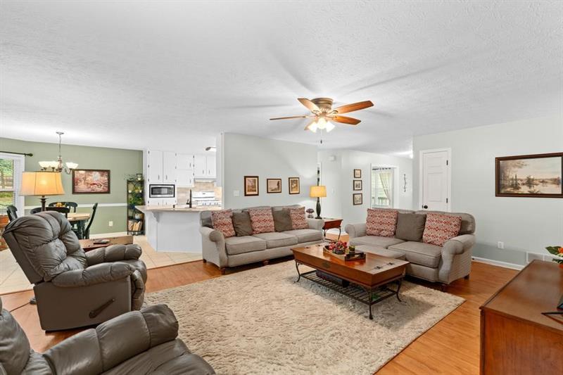 212 Wimberly Ridge McDonough, GA 30253 - Photo 5 of 44 a living room with furniture and kitchen view