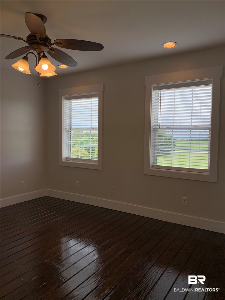 13402 County Road 91 Elberta, AL 36530 - Photo 24 of 32 Master Bedroom w/ Hardwood Floors & Walk-in Closet