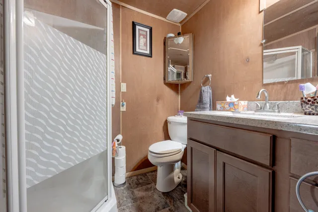 a bathroom with a sink toilet and mirror