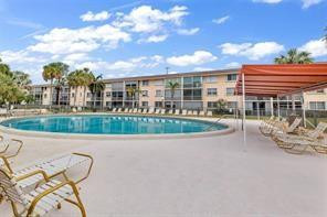 4500 North Federal Highway, Unit 153 Lighthouse Point, FL 33064 - Photo 3 of 7 front view of a house with a yard