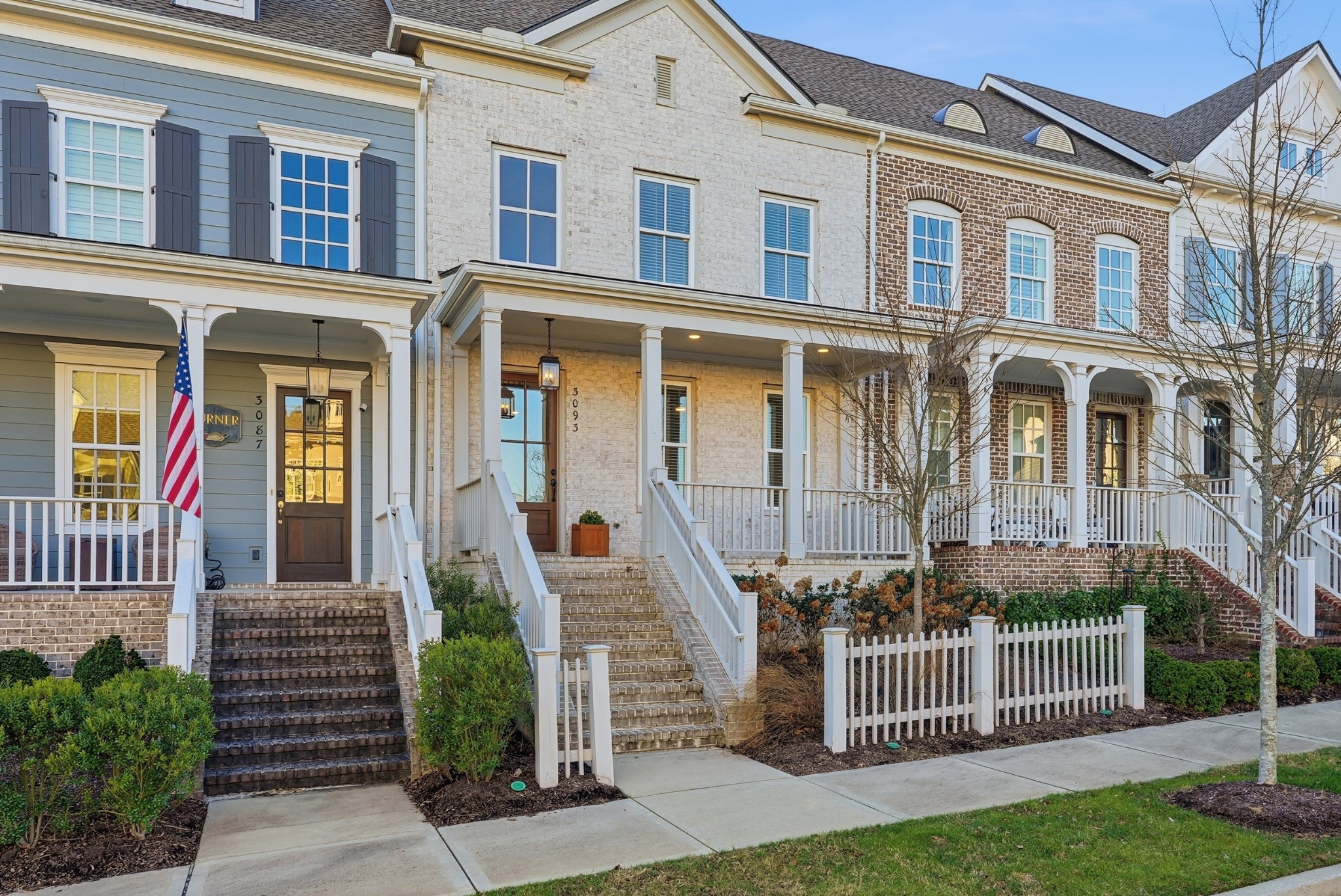 a front view of a house with iron fence