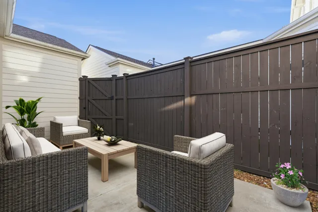 a view of backyard with deck and wooden floor