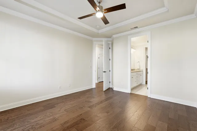 a bathroom with a granite countertop sink double and mirror