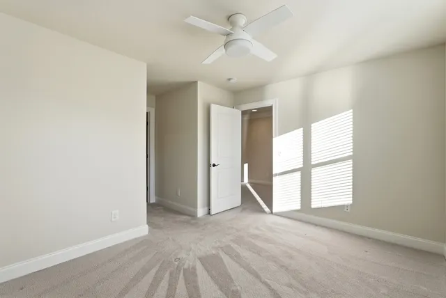 a bathroom with a granite countertop sink a toilet a mirror a bathtub and shower
