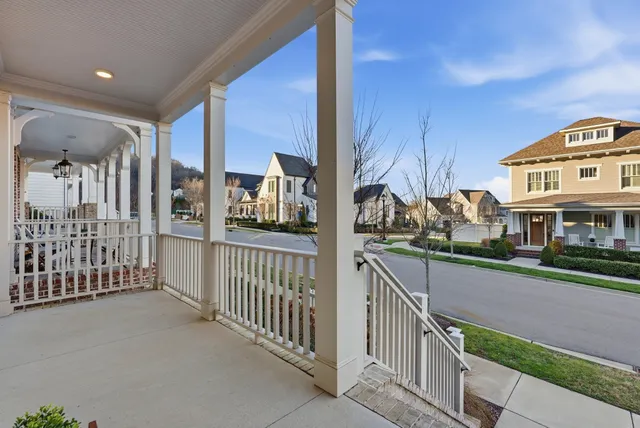 a view of hallway with stairs and wooden floor
