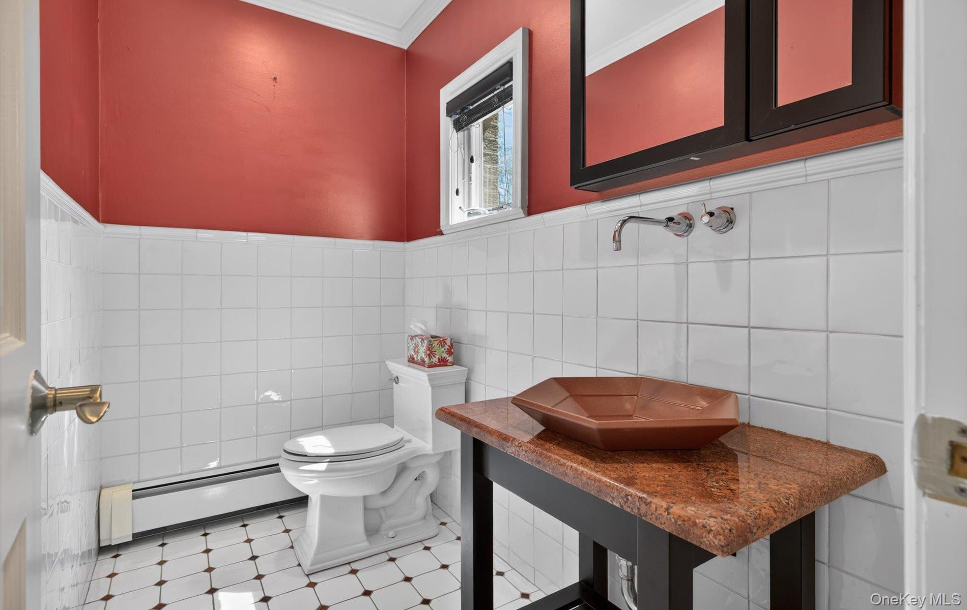 16 East Slope Road Bayville, NY 11709 - Photo 18 of 48 Powder room featuring a wall-mounted faucet, vessel sink, and a granite-look countertop vanity