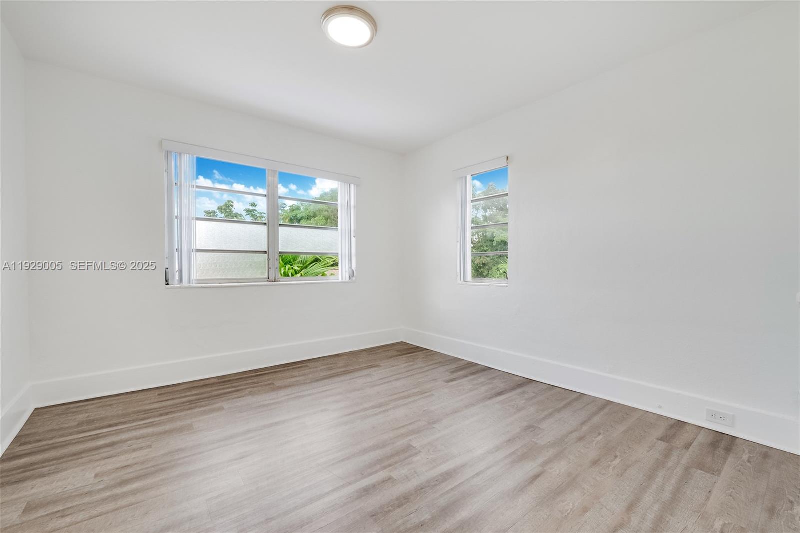 1736 Southwest 9th Street, Unit 1738 Miami, FL 33135 - Photo 7 of 15 an empty room with window