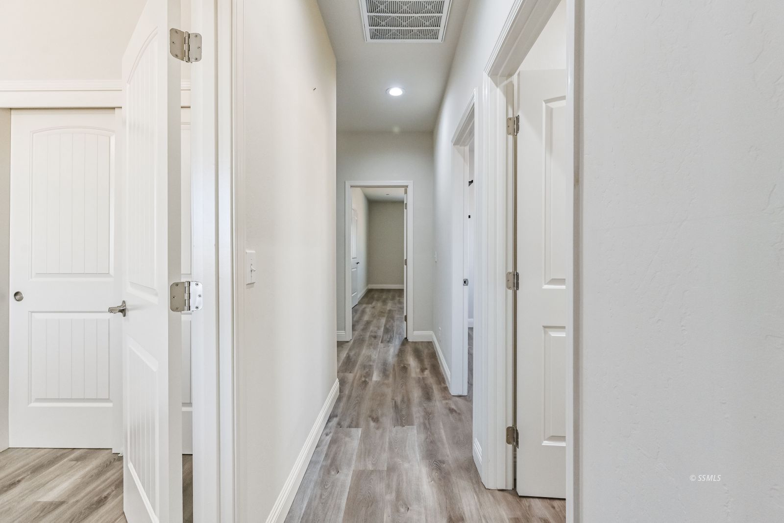 1031 West Church Avenue Ridgecrest, CA 93555 - Photo 23 of 49 a view of a hallway with wooden floor and staircase