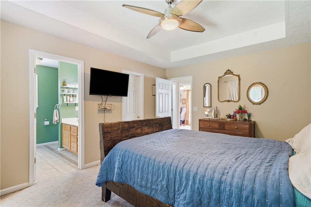137 Orchard Way Southeast Calhoun, GA 30701 - Photo 17 of 39 a bedroom with a bed and a flat screen tv