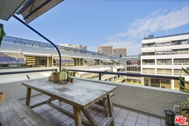 a kitchen with refrigerator cabinets and wooden floor