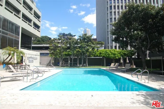 a view of a swimming pool with a patio
