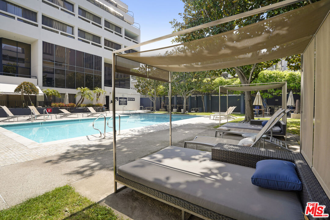 880 West 1st Street, Unit 604 Los Angeles, CA 90012 - Photo 37 of 60 a view of a swimming pool with a patio