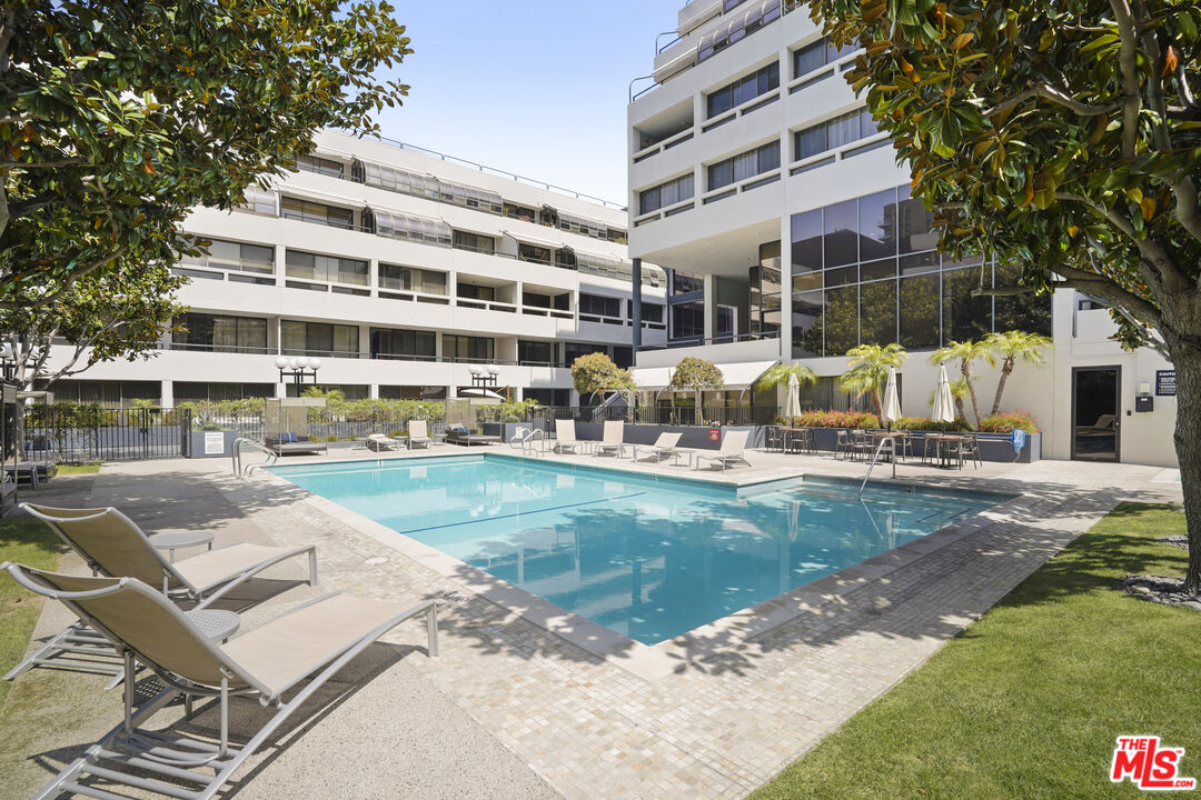 880 West 1st Street, Unit 604 Los Angeles, CA 90012 - Photo 38 of 60 a view of a swimming pool with a patio