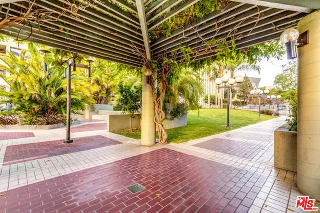 a view of a dining room with furniture and a chandelier