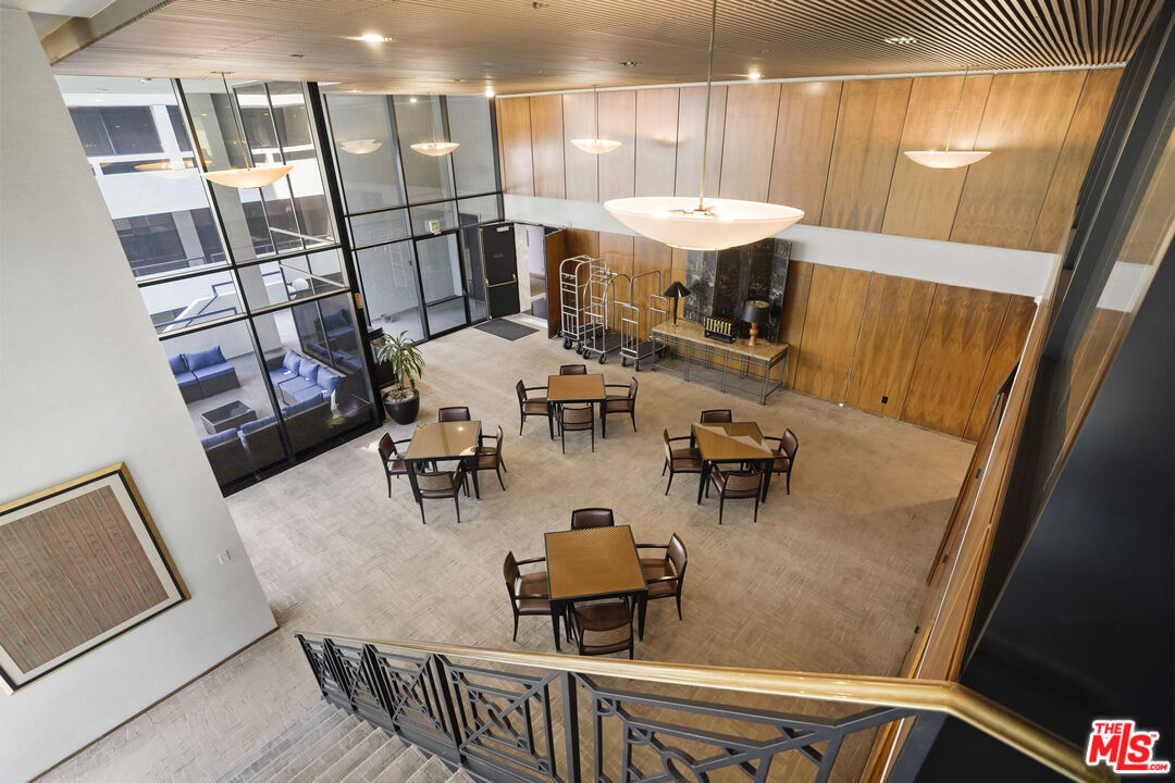880 West 1st Street, Unit 604 Los Angeles, CA 90012 - Photo 50 of 60 a view of a dining room with furniture and a chandelier