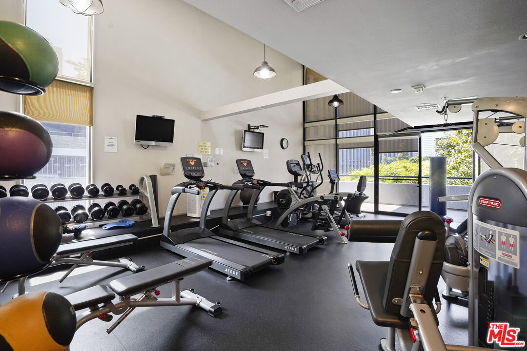 880 West 1st Street, Unit 604 Los Angeles, CA 90012 - Photo 53 of 60 a view of a room with gym equipment