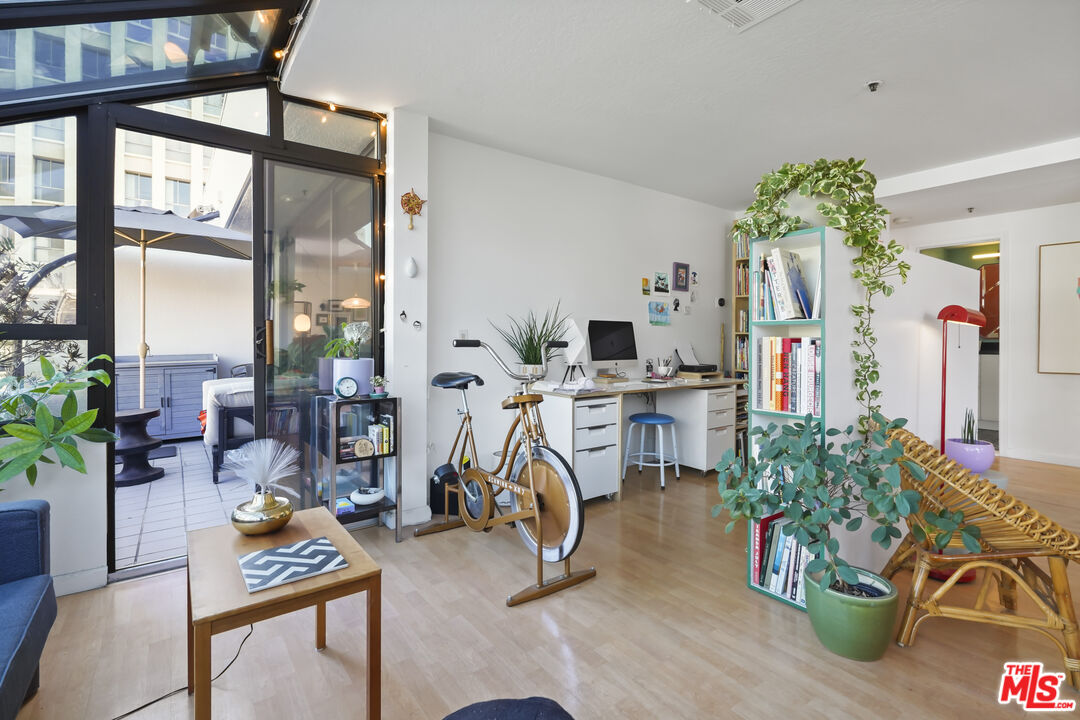 880 West 1st Street, Unit 604 Los Angeles, CA 90012 - Photo 6 of 60 a view of a room with gym equipment