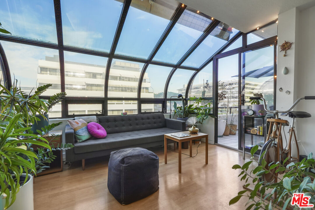 880 West 1st Street, Unit 604 Los Angeles, CA 90012 - Photo 9 of 60 a room with furniture and potted plants