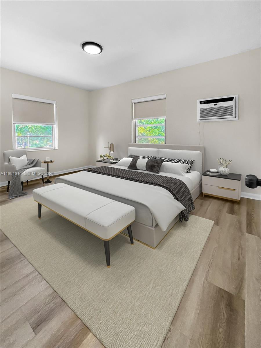 2390 Southwest 22nd Street, Unit 4 Miami, FL 33145 - Photo 5 of 10 a bedroom with a bed and a window