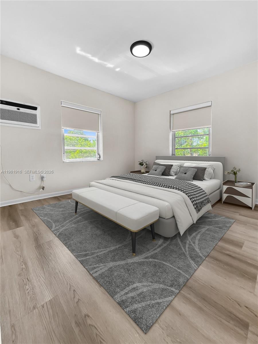 2390 Southwest 22nd Street, Unit 4 Miami, FL 33145 - Photo 6 of 10 a living room with couches and painting on the wall