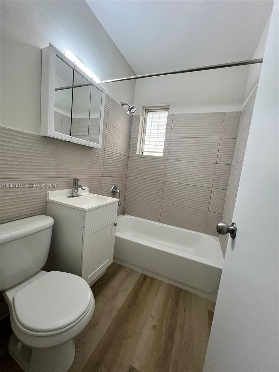 2390 Southwest 22nd Street, Unit 4 Miami, FL 33145 - Photo 10 of 10 a bathroom with a sink toilet and shower