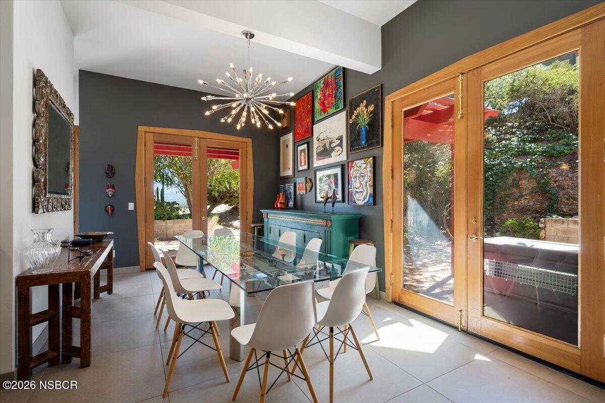 1012 Upper Los Berros Road Nipomo, CA 93444 - Photo 13 of 67 a view of a dining room with furniture large windows and wooden floor