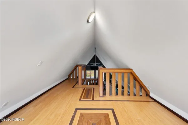 a view of a chairs and table in the balcony