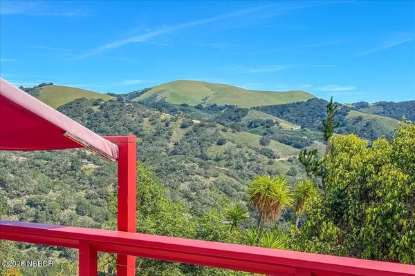 a view of a mountain from a yard