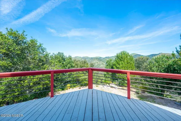 a view of backyard with sitting area