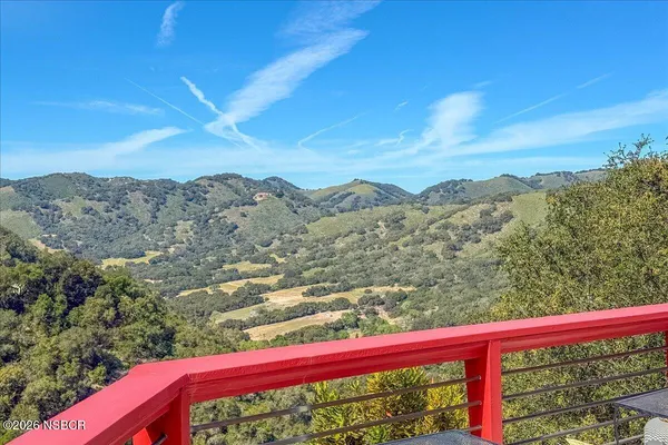 an aerial view of a house with mountain view