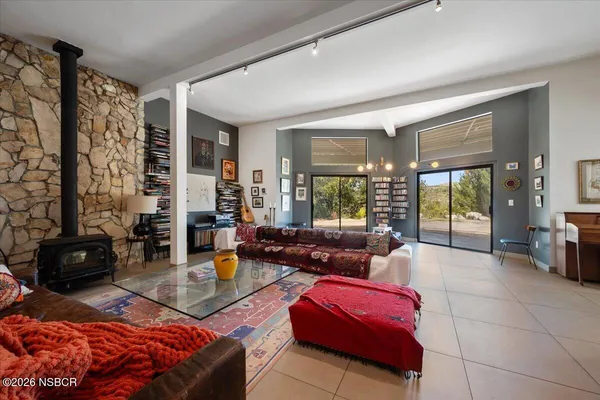 a bedroom with furniture and a chandelier