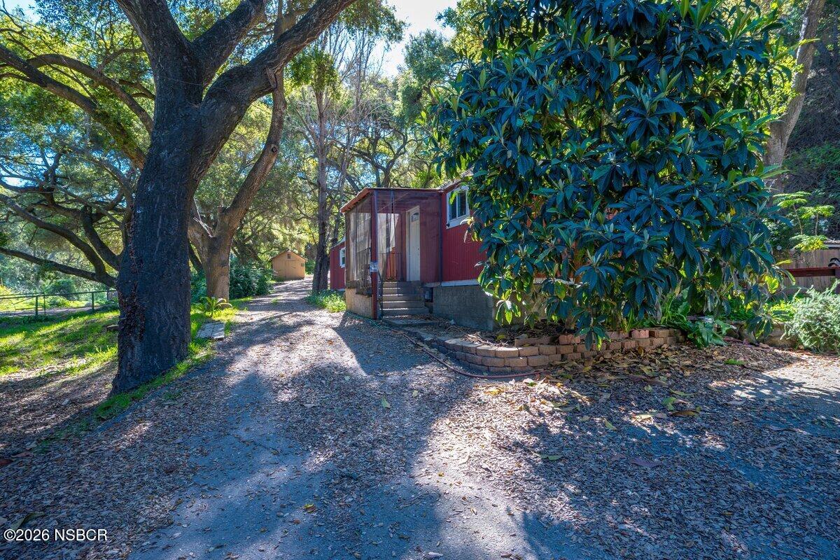 1012 Upper Los Berros Road Nipomo, CA 93444 - Photo 64 of 67 a backyard of a house with lots of green space
