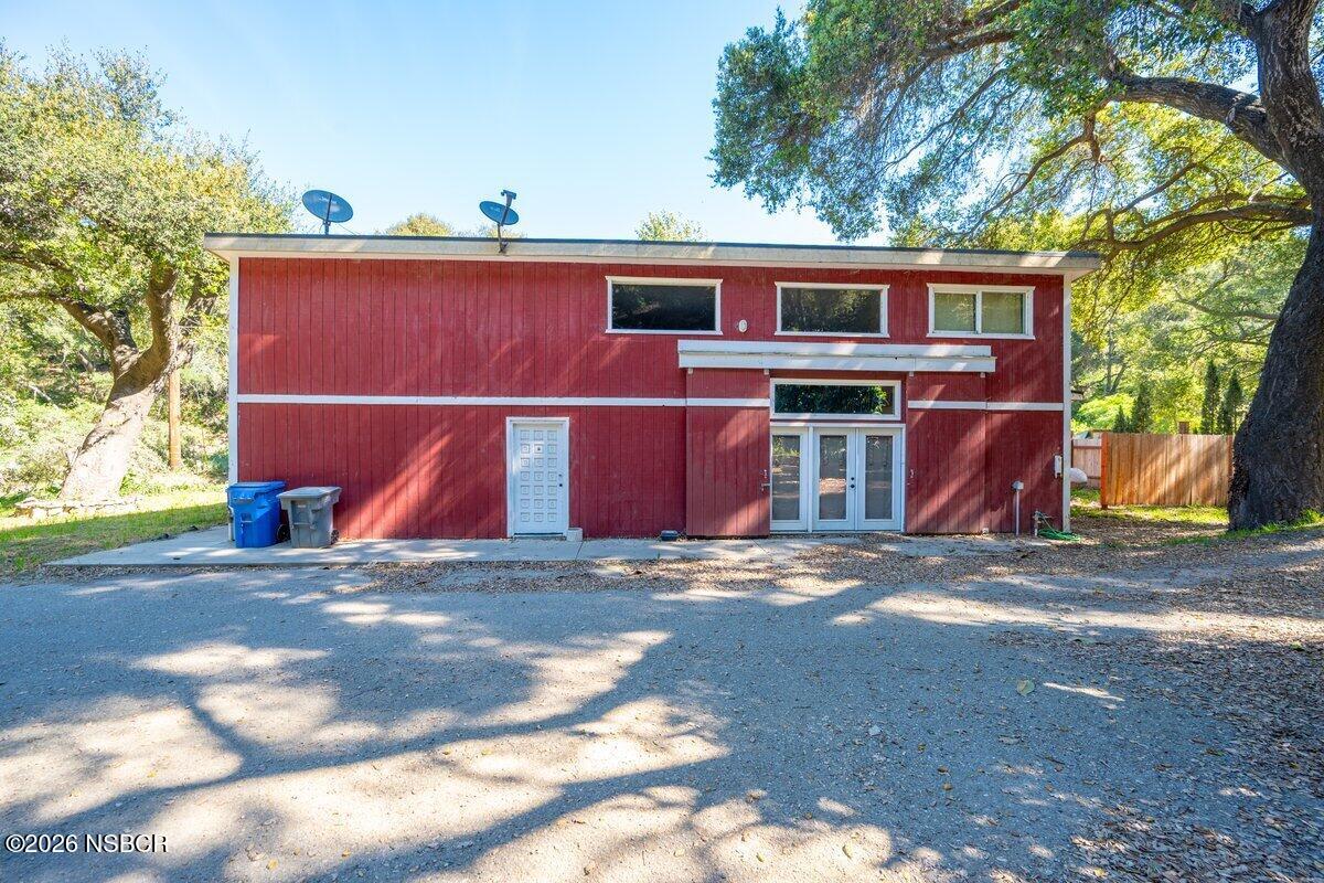 1012 Upper Los Berros Road Nipomo, CA 93444 - Photo 65 of 67 a side view of a house with a garage
