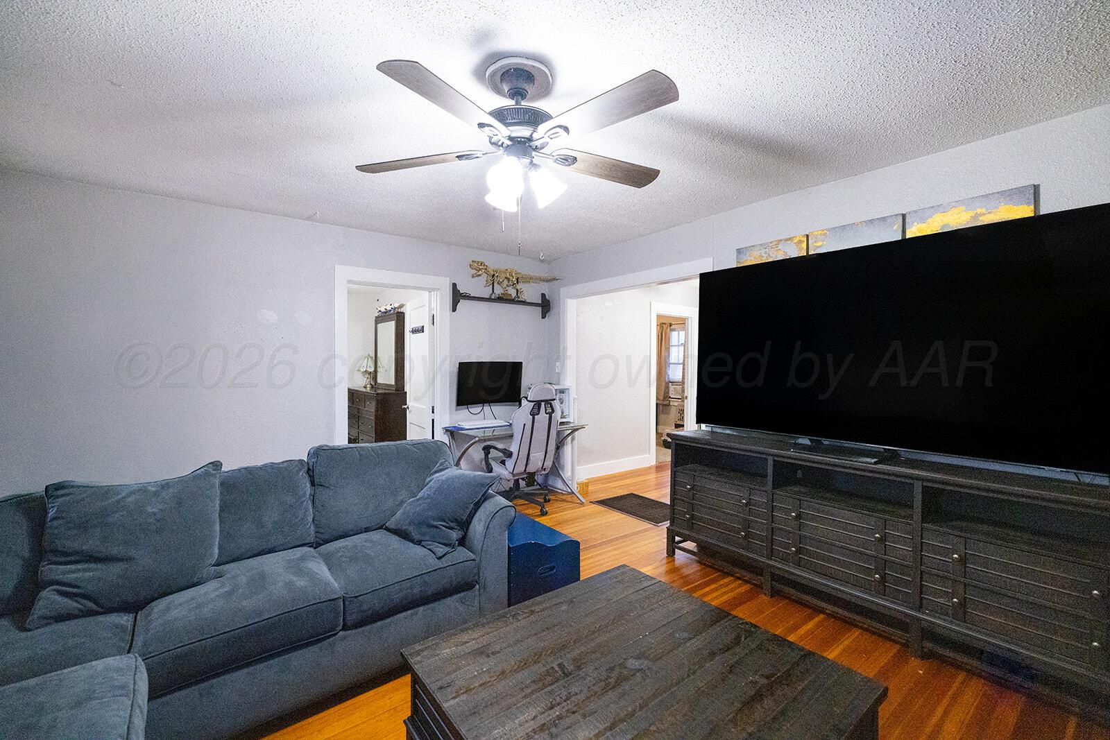 2003 5th Avenue Canyon, TX 79015 - Photo 7 of 19 a living room with furniture and a flat screen tv