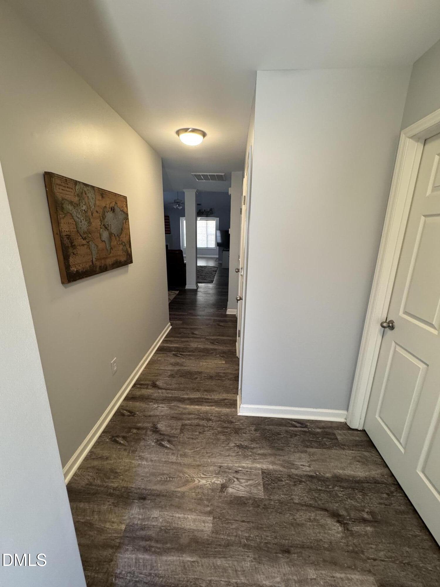 11351 Clubhaven Place, Unit 100 Raleigh, NC 27617 - Photo 6 of 29 a view of a hallway with wooden floor