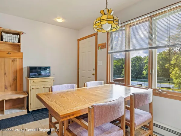 a dining room with a table chairs and a table