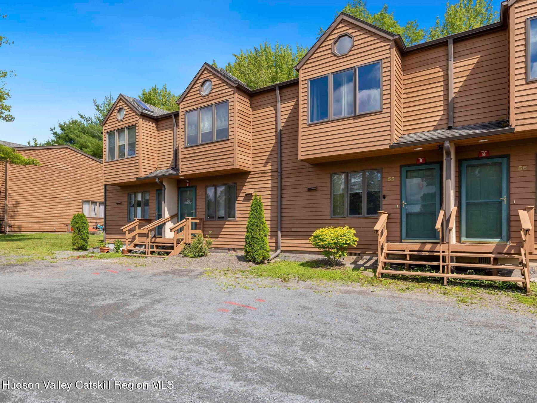 55 Quads Way, Unit 55 Windham, NY 12496 - Photo 2 of 34 a front view of a house with glass windows