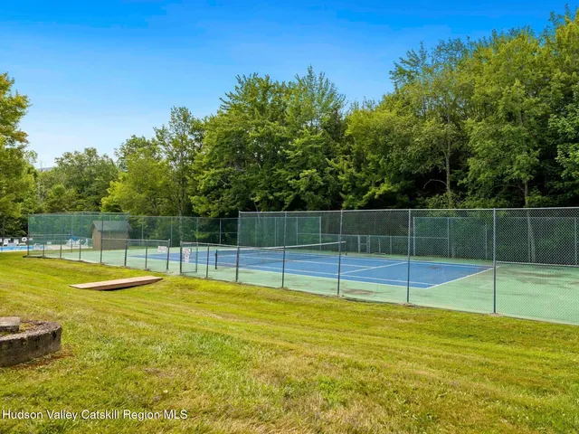 a view of a swimming pool with a yard