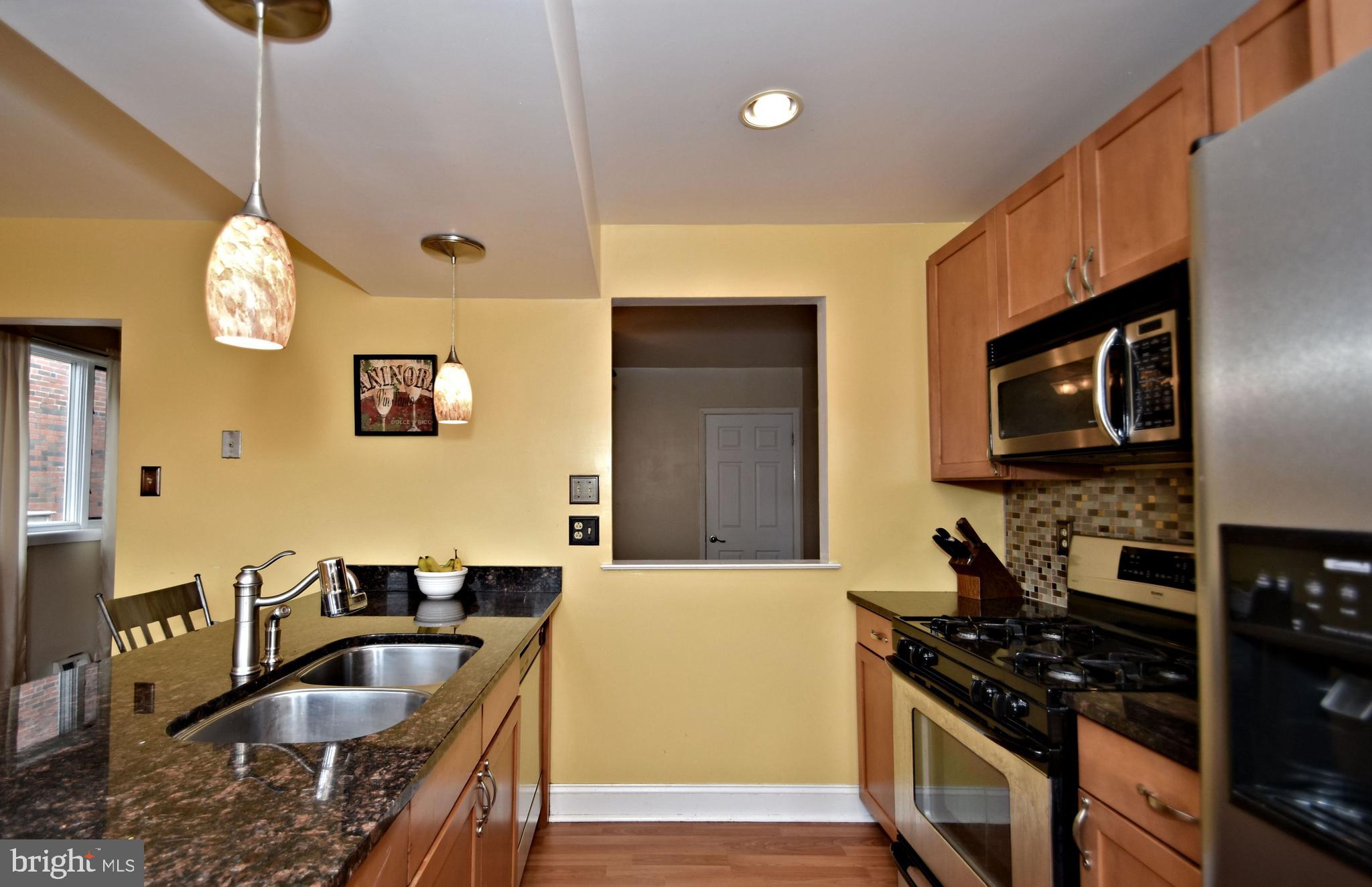 7431 Hill Road Philadelphia, PA 19128 - Photo 13 of 31 Kitchen with pass-through into Dining room