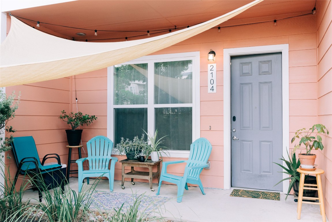 a front view of a house with outdoor seating