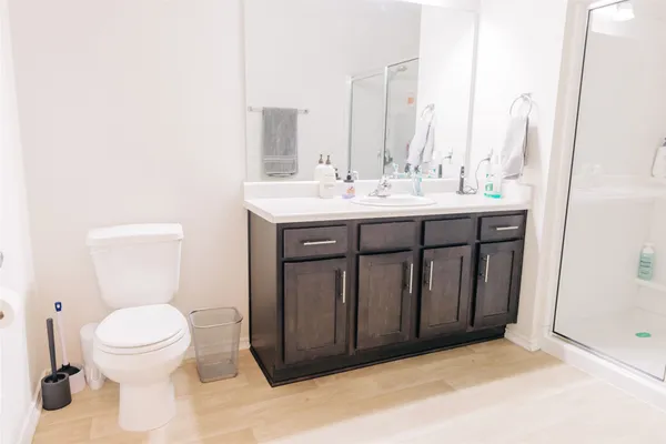 a bathroom with a shower and a sink