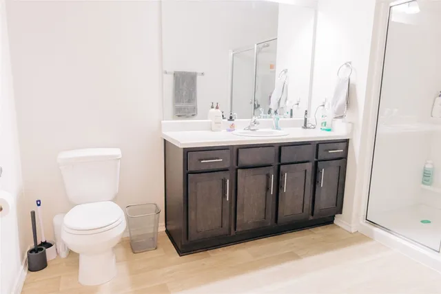 a bathroom with a shower and a sink