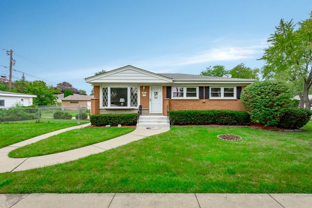 7500 Beckwith Road Morton Grove, IL 60053 - Photo 2 of 27 a front view of a house with a yard