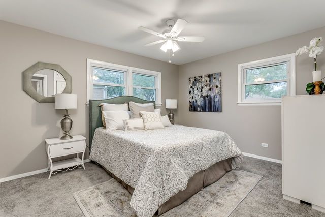 7500 Beckwith Road Morton Grove, IL 60053 - Photo 11 of 27 a bedroom with a bed and a painting on the wall
