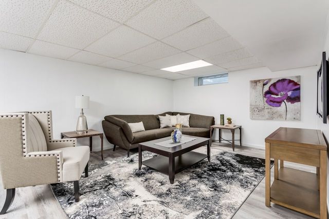7500 Beckwith Road Morton Grove, IL 60053 - Photo 13 of 27 a living room with furniture and wooden floor