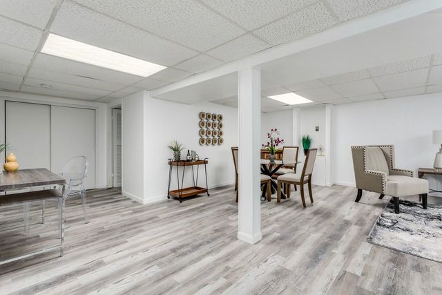 7500 Beckwith Road Morton Grove, IL 60053 - Photo 15 of 27 a dining room with furniture and wooden floor
