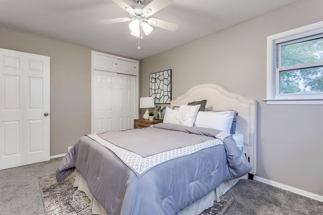 7500 Beckwith Road Morton Grove, IL 60053 - Photo 16 of 27 a bedroom with a large bed and a window