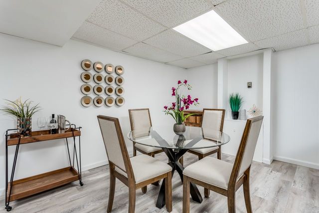 7500 Beckwith Road Morton Grove, IL 60053 - Photo 18 of 27 a dining room with furniture and wooden floor