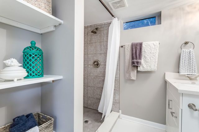 7500 Beckwith Road Morton Grove, IL 60053 - Photo 20 of 27 a bathroom with a sink and a shower