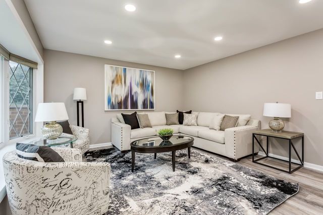 7500 Beckwith Road Morton Grove, IL 60053 - Photo 4 of 27 a living room with furniture and window